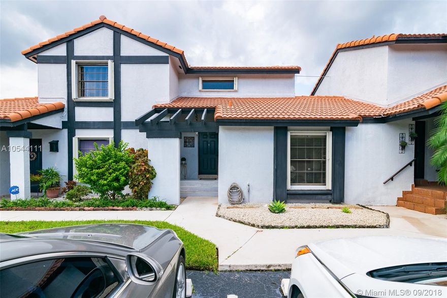 This is a rare opportunity to own a Lakes of the Meadow Village Home. This completely remodeled turnkey property features 3 bedrooms, 3 baths & a loft. Kitchen has upgraded granite counter tops, wood cabinets, stainless steel appliances, pantry and lots of natural light through gorgeous French doors. All new tile flooring throughout and laminated wood floors on 2nd floor. 2 master bedrooms & one bedroom on ground level. Newer A/C unit. Accordion shutters & impact doors. Enjoy the view of the greenery and one of the community pools from your own open balcony. Great backyard space for entertaining, paved & fenced for privacy. Walk out straight to pool area. Sought after community features 2 pools, cabana, gym, tot-lot, multiple sports courts, & more. Great location * A rated school zone *