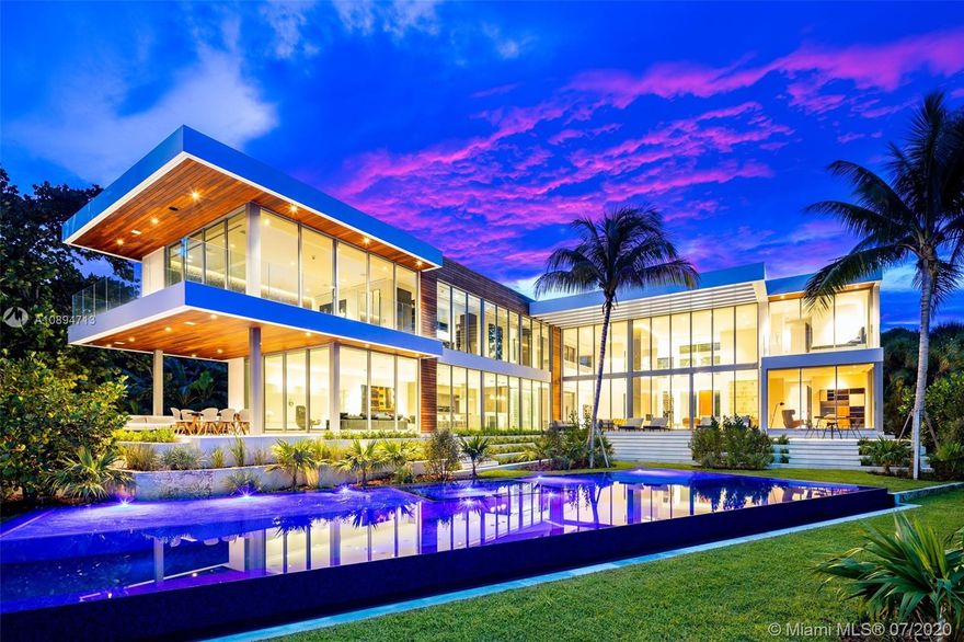 “La Casa Palma” - An unparalleled contemporary estate impeccably designed by World Renowned Architect Kobi Karp, interiors by Borges+Associates, and built by MV Group. Situated in the private community of Bay Point, the open floor plan makes this the perfect home for entertaining with endless water views. Separate guest house with private entry and sunset deck. Movie theatre, gym, spa, wine cellar, and glass elevator. The backyard of your dreams overlooking the Miami Beach skyline, lap pool and built in chefs summer kitchen. Miami waterfront living at its very finest.