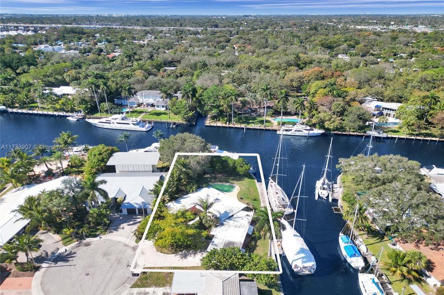 HUGE Corner Point Lot on the New River with 230FT of Waterfront & multiple docks. AMAZING VIEWS! This 3/3 pool home sits on over 15,000 SqFt Lot at the end of a cul-de-sac of Citrus Isles in Fort Lauderdale. This is your chance to buy a home w/ 4 docks with deep water just 35 minutes from the inlet. No HOA and no restrictions on seasonal rentals with required licenses. The views from every room are directly on the river where you will enjoy all kinds of vessels cruising by and some of the best sunsets! The wide river allows you to dock the wider beams as the river is approx. 140FT wide.  The location could not be better as you are minutes to Downtown/Las Olas, the beach, Fort Lauderdale International airport, all kinds of shopping, Whole Foods, & Hard Rock Casino!! Views are gorgeous!