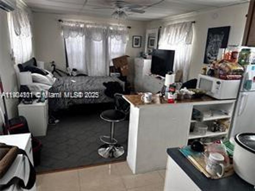 COZY STUDIO APARTMENT,UPSTAIRS UNIT.TILED THROUGHOUT.SPACIOUS KITCHEN WITH A COUNTER,REFRIGERATOR,AND A HOT PLATE.MICROWAVE,SINK.NEWER A/C UNIT.UTILITIES INCLUDED (WATER/GARBAGE/ELECTRICITY). CLOSE TO DINING,EXPRESSWAYS,BEACHES,ENTERTAINMENT.RAPID APPROVAL.NO HOA.