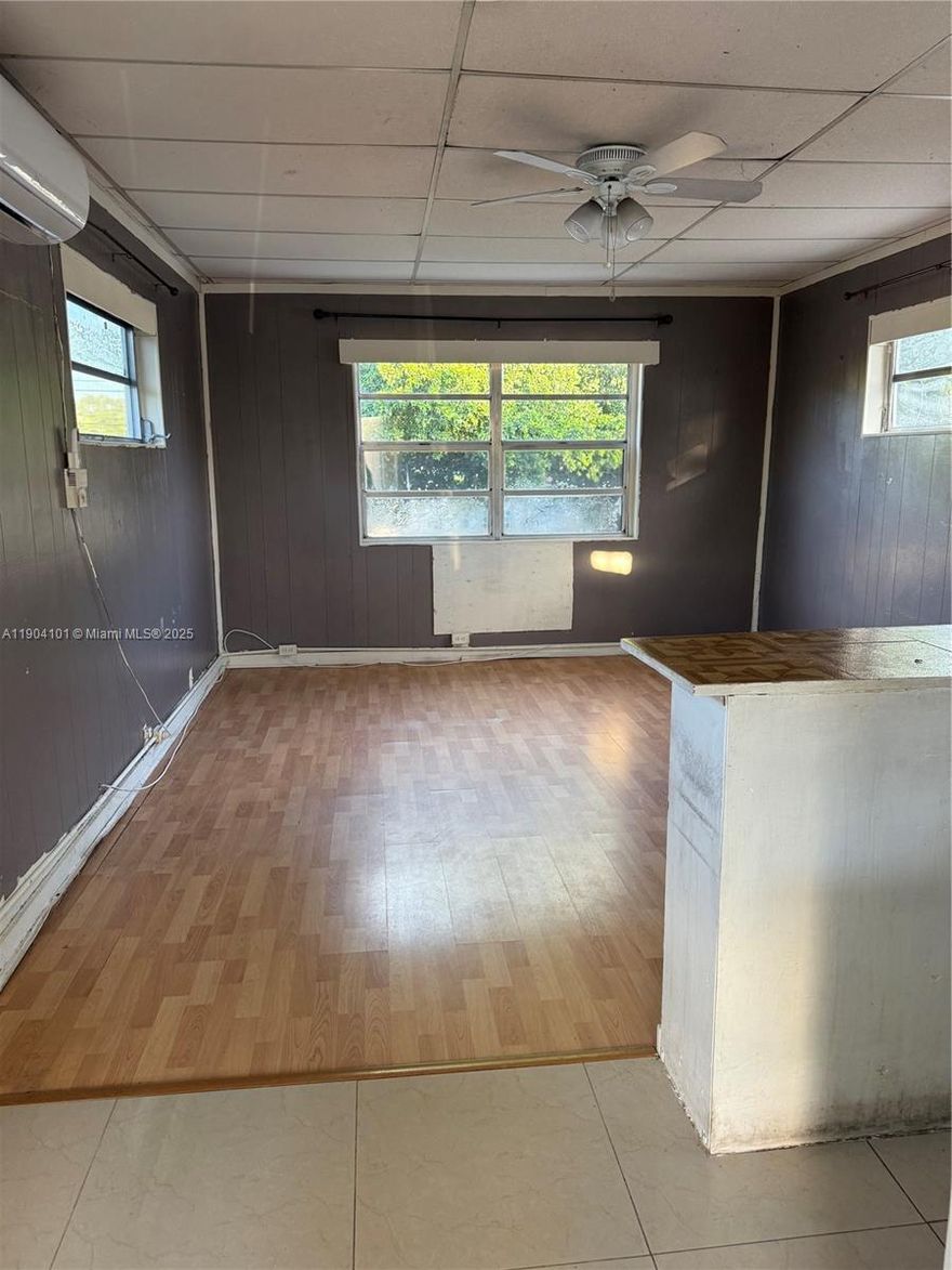 COZY STUDIO APARTMENT,UPSTAIRS UNIT.TILED THROUGHOUT.SPACIOUS KITCHEN WITH A COUNTER,REFRIGERATOR,AND A HOT PLATE.MICROWAVE,SINK.NEWER A/C UNIT.UTILITIES INCLUDED (WATER/GARBAGE/ELECTRICITY). CLOSE TO DINING,EXPRESSWAYS,BEACHES,ENTERTAINMENT.RAPID APPROVAL.NO HOA.