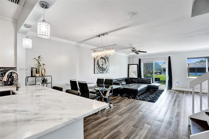 IMPROVED PRICING. Beautifully updated 3-bedroom, 2.5-bath waterfront townhome located in the desirable Springtree West Cove community in Sunrise. This spacious two-story home offers 1,556 sq ft of living space with an open layout, modern finishes, and peaceful canal views.

The updated kitchen features white shaker cabinetry, quartz countertops, stainless steel appliances, and modern backsplash, opening to the main living and dining areas. Upstairs you'll find a large primary suite with custom closet built-ins and an updated bathroom, plus two additional bedrooms and full bath.

Step outside to your private patio and deck overlooking the canal, perfect for relaxing or entertaining.

Major upgrades include impact windows (2025), tankless water heater (2023), HVAC (2017), and roof (2008).

Additional features include vinyl flooring, interior laundry, attached garage, and multiple parking spaces.

Low HOA includes lawn maintenance and community pool. Conveniently located near Sawgrass Expressway, Sawgrass Mills Mall, Amerant Bank Arena, parks, shopping, dining, and top-rated schools.

A great opportunity to own a move-in ready waterfront home in the heart of Sunrise.