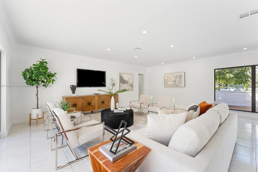 Beautiful oversized corner lot with a preserved greenspace across the street. This home has a split floor plan and has two large areas that are perfect for entertaining. Spectacular features include: two expansive courtyards, brick columns, and large windows, providing natural light. Located near several top schools in Miami! Walking distance to Bay & Lugo Point. Pinecrest Elementary School district.