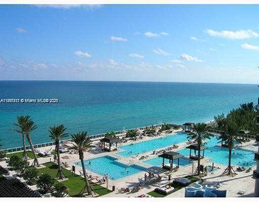 Desirable two bedrooms, two baths. This particular unit has designer finishes, marble floors, built in walk-in closets, and window treatments in every room. Kitchen features stainless steel appliances. Impeccable, with direct ocean and city views. Sunset balcony off the master bedroom. Private beach with dedicated beach attendants. The building amenities include 24 hours security, conference room, party room, coffee room, luxurious spa, fitness center, pool deck with multiple pools, jacuzzi and restaurant