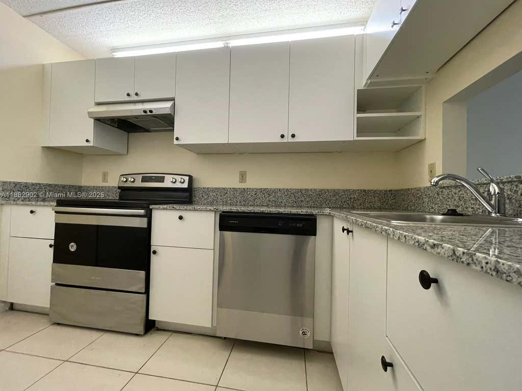 Photo of 820 Twin Lakes Dr #820, Coral Springs, FL 33071 (MLS # A11862902)