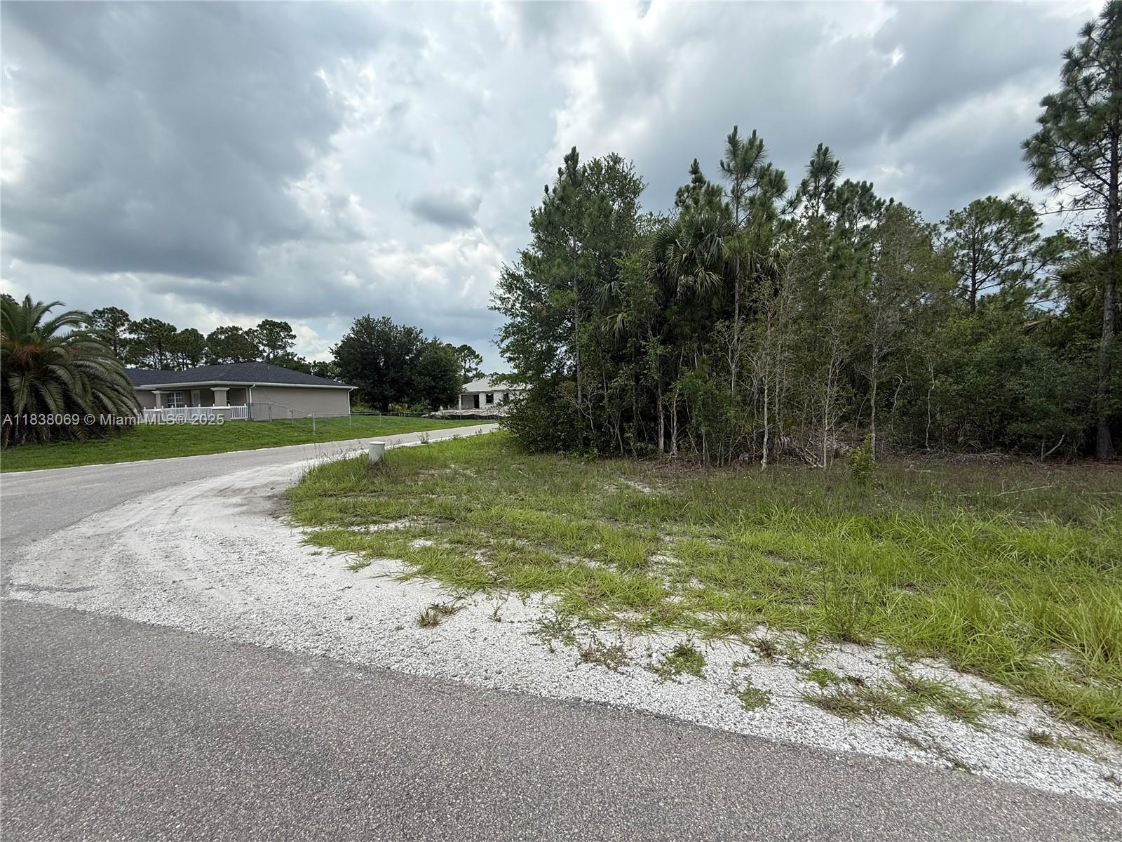 Corner lot for sale in Lehigh Acres! This quarter-acre parcel is located on a desirable corner, surrounded by newer homes and ideal for building your dream home or investing in a growing residential area. Situated in a non-flood zone and with no HOA, it offers flexibility and convenience. Easy access to schools, stores and major roads makes this a smart choice for future development. Great opportunity in one of Lehigh Acres’ expanding communities.