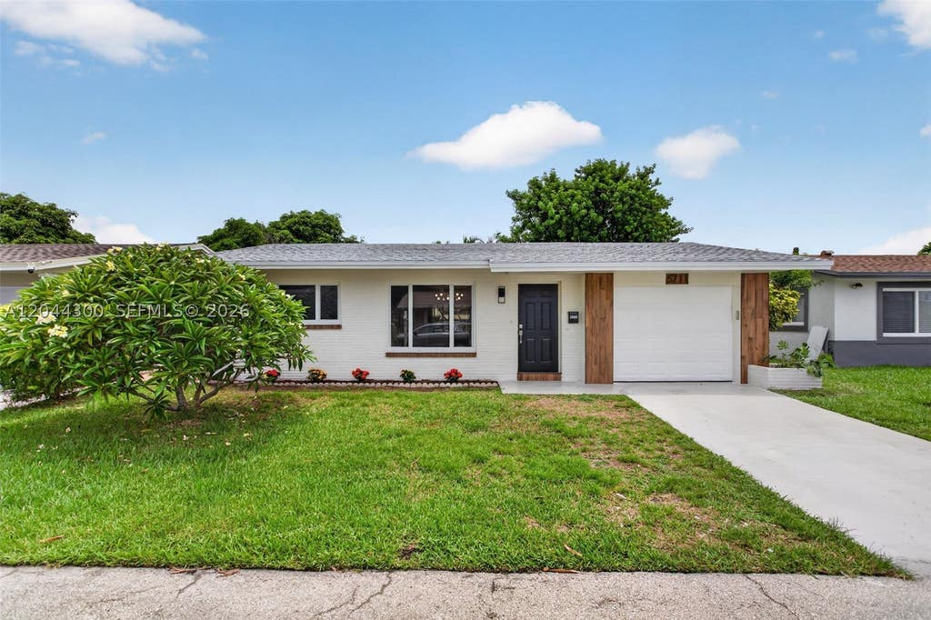 Photo of 5711 NW 48th Ter, Tamarac, FL 33319 (MLS # A12044300)