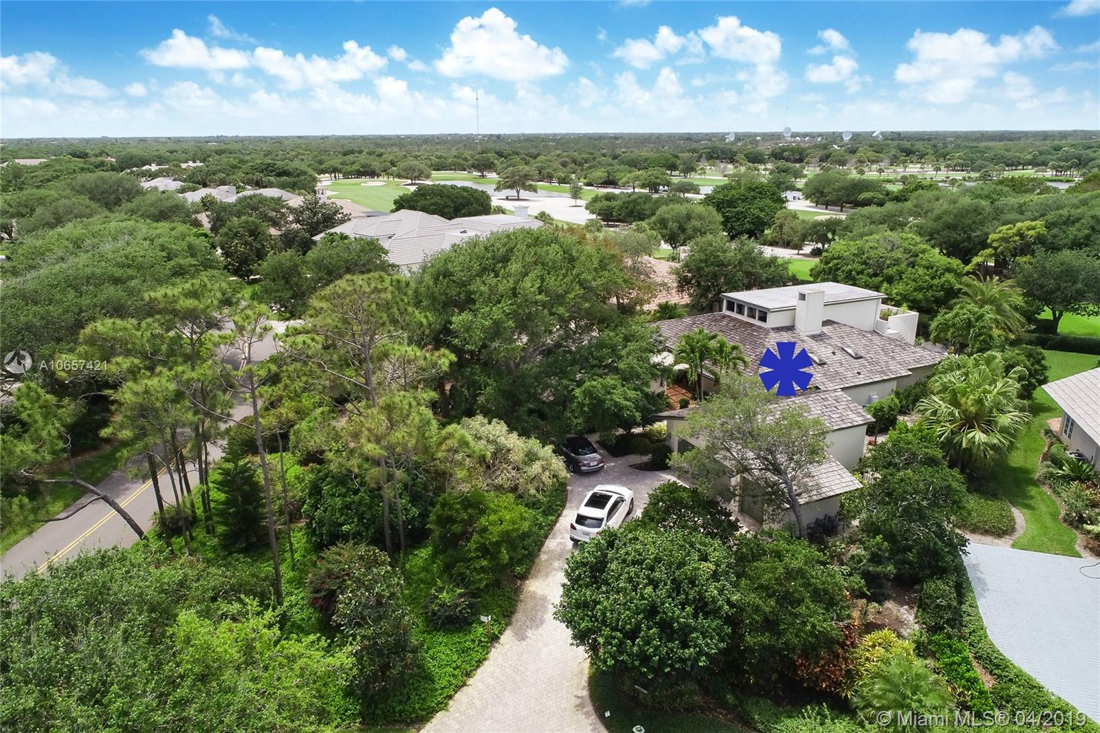 Incredible 2 story golf course home with separate guest cottage ideally located on the opening hole of Jupiter Hills Village golf course.  It features oversized Master Suite with walk in closets & 2 Guest Suites in the main house.  The Guest House has its own terrace & full size living room.  4 BRs each with its own full bath.  Professionally updated kitchen overlooks the pool, spa & charming gardens.  Living/dining room all enjoy the cozy fireplace.  Upstairs you will be welcomed by an expansive library/media room with outdoor balcony for relaxing & enjoying the ocean breezes.  Your views of the prestigious golf club & golf course are breathtaking.  Ext. highlights:Roof 2013, generator '17, summer kitchen,water well &#x2026; a highly desirable Village Drive neighborhood conceived by George Fazio