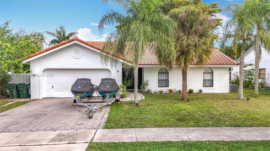 One Story 3/2 Single Family Home with 2-car garage in highly desired Hidden Valley neighborhood in East Boca. Home offers a spacious open concept with living room, family room, and dinning room all with a view to the back yard. Yard fenced in. New Kitchen with lots of storage. Enjoy large master suite with walk-in closet and master bath. Bedrooms have newly installed vinyl flooring, home is freshly painted inside and out, bathrooms partially updated. Laundry room. Community amenities include a playground, pickleball, and tennis courts. It is located only minutes away from Boca's pristine beaches and Mizner Park. Easy access to 1-95. it is conveniently close to all the great stores. Located in the excellent Boca Raton Community School district. Lot is larger than fenced in area. NO HOA.