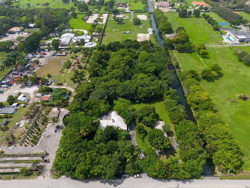 REDUCED PRICE, MOTIVATED SELLER! GREAT OPPORTUNITY TO OWN A 4.5 ACRE (193,842 SF) IN MIAMI’S HORSE COUNTRY.  3 EXISTING STRUCTURES: MAIN HOUSE IS 5 BDR & 4.5 BATHS PLUS AN EFFICIENCY APT & POOL. GUEST HOUSE IS 3 BDR & 1 BATH, PLUS LARGE WORKSHOP. SERVICE HOUSE IS LOCATED IN THE BACK OF THE PROPERTY.  TOTAL S.F. OF THE STRUCTURES IS ABOUT 10,000 SF. 
THE LOT & PROPERTIES ARE READY TO REMODEL OR BUILD UP TO 9 UNITS. PROPERTY USED TO BE ANIMAL SANCTUARY/REFUGE. LOTS OF LANDSCAPING & NATURAL TREES, NEXT TO THE CANAL ON THE NORTH SIDE OF THE PROPERTY. ONE OF A KIND SUPER PRIVATE FAMILY COMPOUND, BUT COULD BE USED FOR HORSE STABLES, EQUESTRIAN, BARNS & MORE. RIGHT OFF OF SUNSET DR AND TURNPIKE. CALL/TEXT TO WALK THE PROPERTY SO YOU CAN ENVISION & PLAN ALL THE SPACES THIS PROPERTY HAS TO OFFER!
