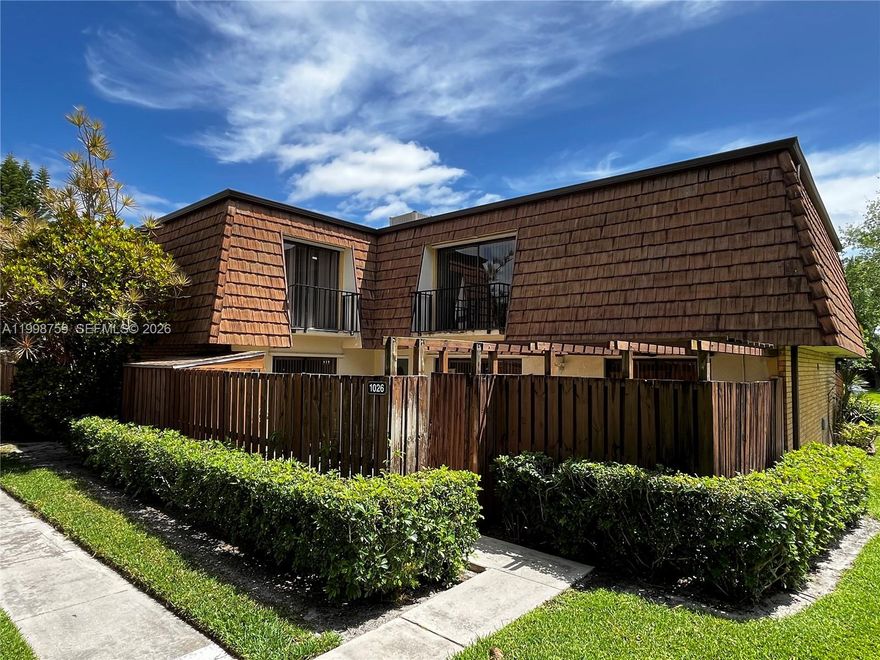Updated interior with newer kitchen and bathrooms – nice tile on 1st and 2nd floors with this 3/3 floorplan.  Features include SS appliances, quartz kitchen counters, storage shed in private courtyard and hurricane shutters. Less than one block away from some community amenities.