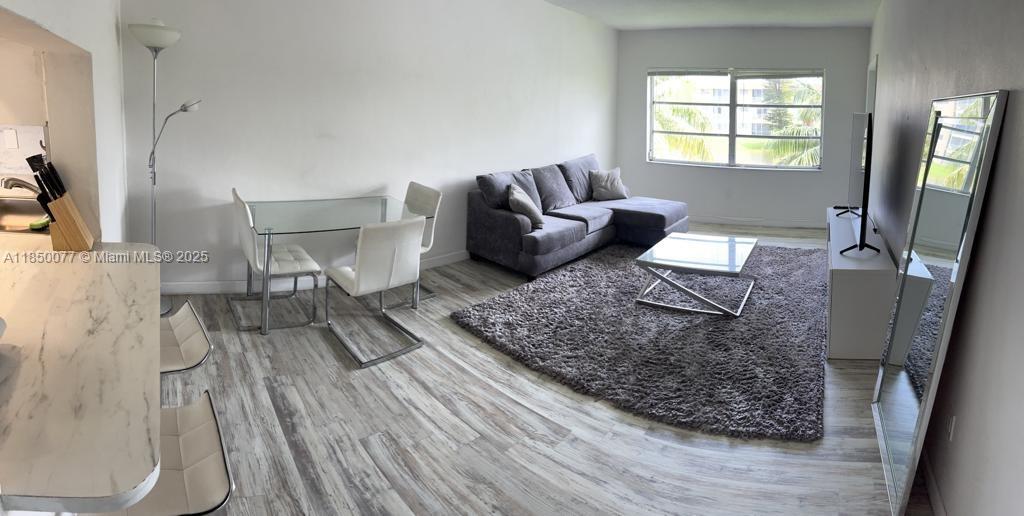 Location, location, location!!! Walking distance to the Aventura Mall, supermarkets, restaurants, CVS and Walgreens. Enjoy the lake view from this well-maintained and furnished 1 bedroom, 1 bathroom and 1 half bathroom. Wood floors throughout. The enclosed balcony can be used as an office. All ages are welcome. Second floor. Restriction to only 2 adult people as residents in the unit. Building amenities include a beautiful lakefront pool, party room, one assigned parking space, guest parking (no overnight stay), water, and laundry room. The community has security patrol and Aventura Shuttle Service. Association approval is required, and takes about a month. No pets are allowed. Property is occupied by a tenant until August 31st.