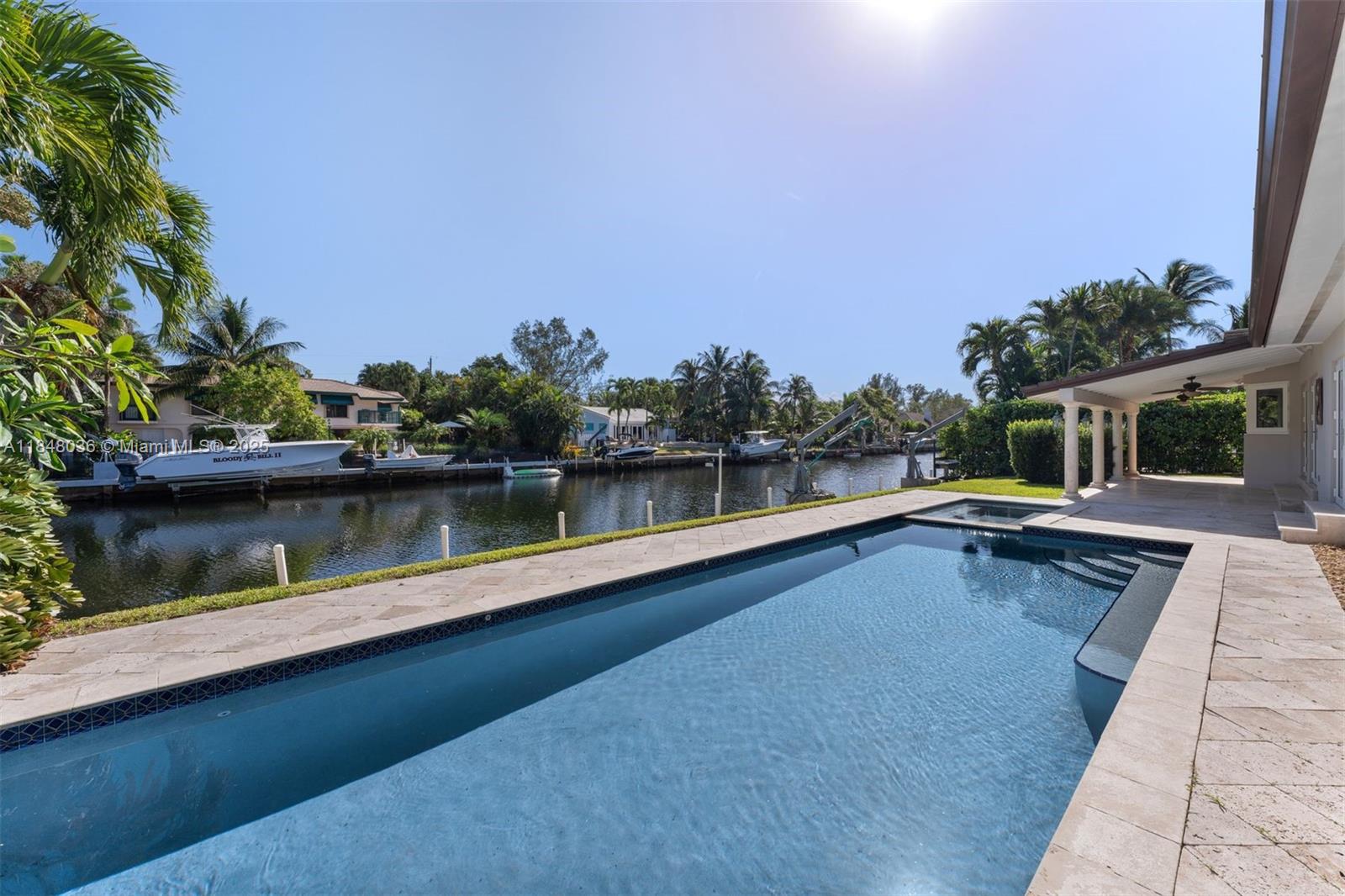 Updated ranch-style single-story home in the sought-after Gables by the Sea community. Situated on a quiet double cul-de-sac w/convenient access to the community park w/basketball court & playground. A boaters dream with OCEAN ACCESS to Biscayne Bay from the 100’ seawall & davits. Sleek marble & wood floors. Over 3000 SF offering 4BD 3 full BA, walk-in closets. Extra 5th room w/ensuite cabana bath, ideal for home office, gym or bdrm. Expansive open modern kitchen w/hi-end appliances, 6-burner gas range & wine cooler. FL room complete w/full bar, leads out to the east-facing covered veranda for refreshing al fresco poolside dining. Luxurious pool & spa are heated for year-round enjoyment. Interior Laundry/utility room and a 2-car garage with circular driveway. Full Impact glass, newer AC.