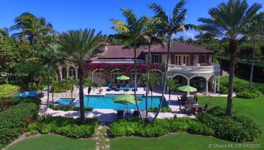 Located along the Intracoastal Waterway on Jupiter Island, this 2-story, 5 bedroom, 6 full bath, 2 half bath home is ideal for those who appreciate architectural artistry at its finest. Each room within the 10,681 +/- sqft interior is enhanced with exquisite woodwork and appointments. Recent renovations bring a delightfully new, bright and open feel to the original 1997 structure. The rear of the home has been remodeled to create a sunny transition from formal living spaces to the outdoors by designing a beautiful entertainment area opening through sets of French doors to lush scenery, swimming pool/spa, covered porch and picturesque river views.