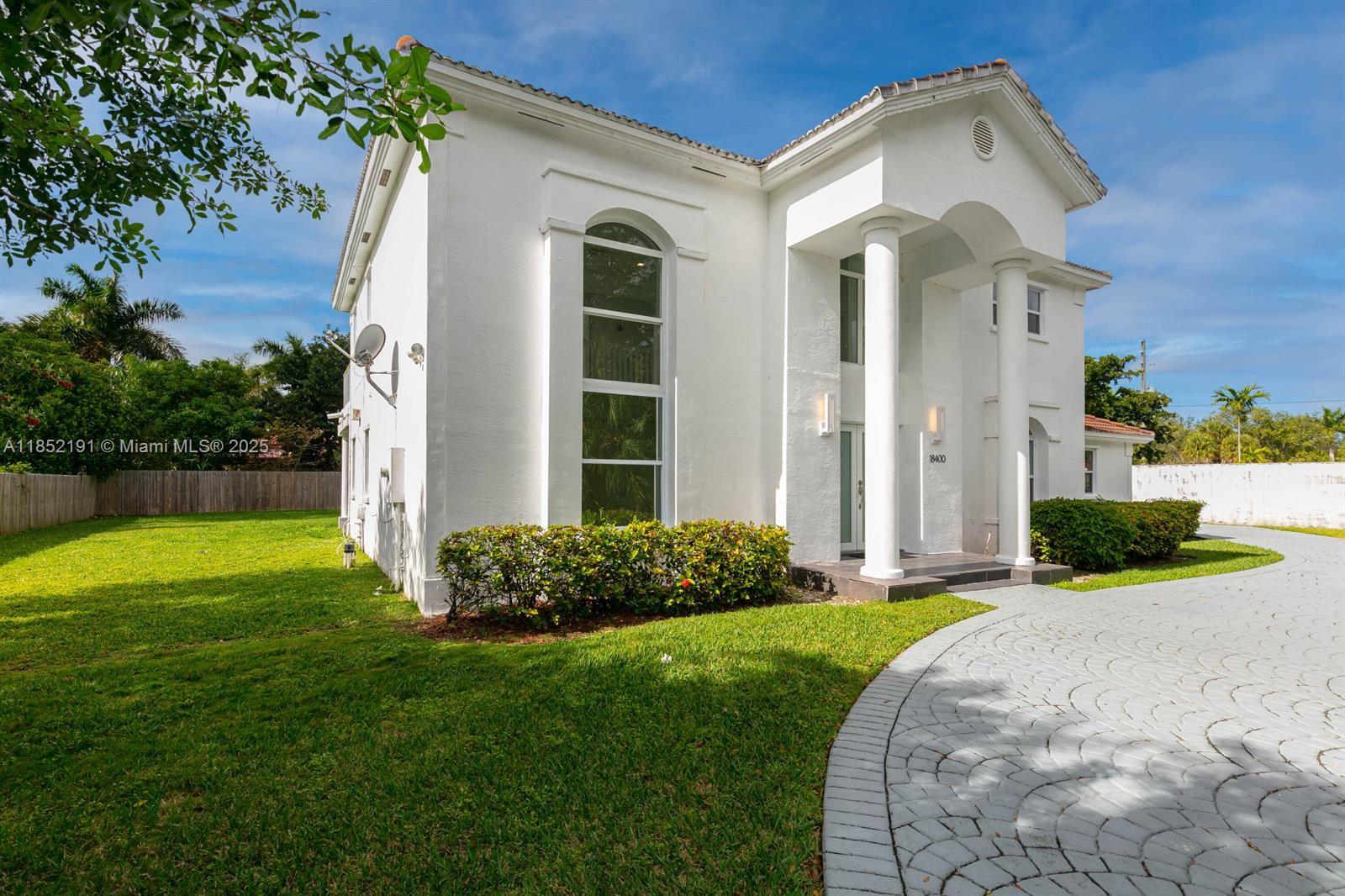 Elegant, completely remodeled, modern and spacious 4 Bedroom, 3 Bathroom mansion. Cul de sac street. Impact windows throughout. White porcelain flooring throughout. 22' High ceilings. New kitchen and bathrooms. New appliances. New glass shower enclosures in all bathrooms. White quartz counters and backsplashes. Motorized gated entry. Covered porcelain tiled patios. Adjacent to Old Cutler road, across from bay. Cool bay breezes. Excellent schools and houses of worship.