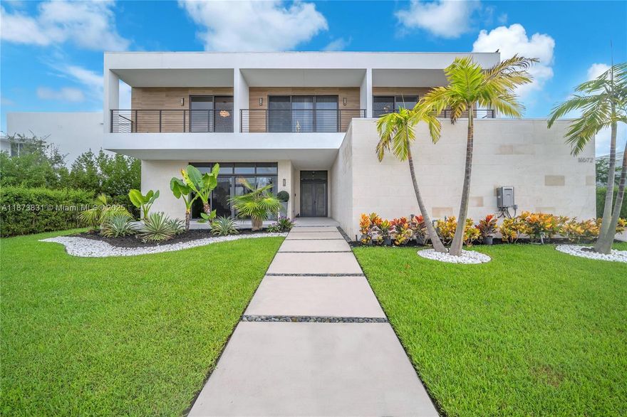 A modern jewel in Botaniko. This estate pairs cutting-edge design with resort-style living. Featuring 6 ensuite bedrooms, private office, the residence is wrapped in walls of glass that showcase shimmering lake views & fill every room with natural light. A chef’s kitchen with sleek cabinetry & premium appliances anchors the home, opening to expansive spaces for entertaining & relaxed everyday moments. Step outside to your private oasis with sparkling pool & dining terrace—all framed by serene water views. The primary suite is a sanctuary with spa-inspired baths & boutique-style closets, while generous bedrooms provide comfort & privacy. Nestled in Weston’s premier gated enclave near elite schools, dining & airports, this property blends modern luxury, exclusivity & South Florida lifestyle.