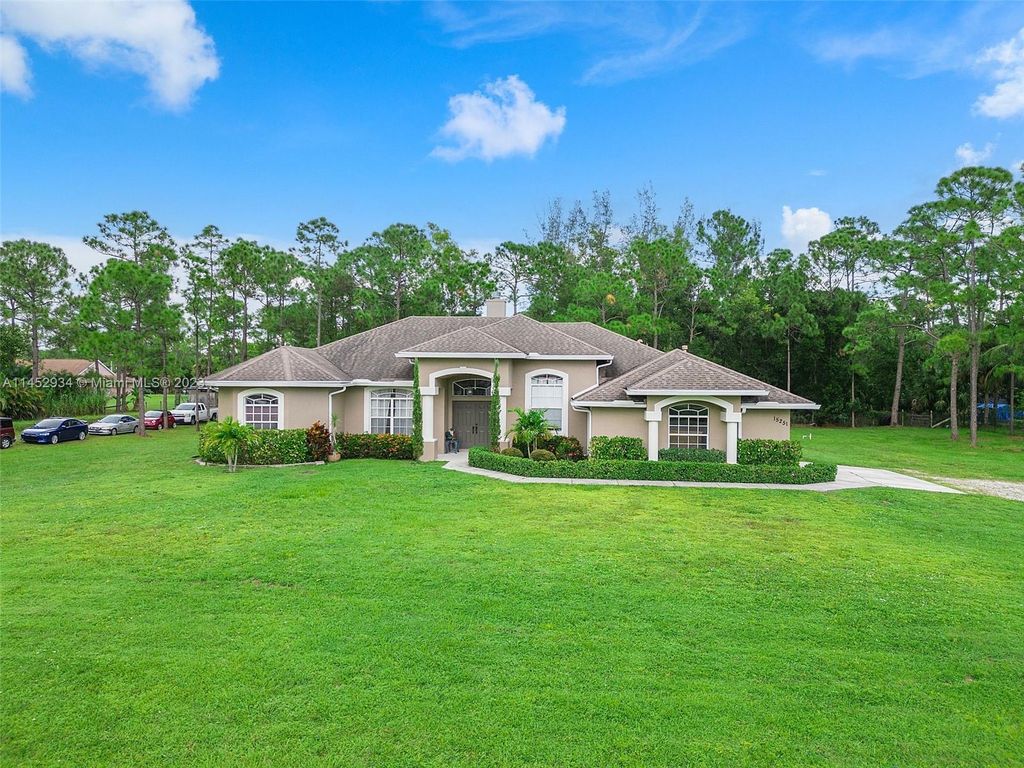 Photo of 15251 Tangerine Blvd, Loxahatchee, FL 33470 (MLS # A11452934)