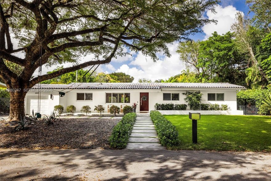 Tucked at the end of a quiet street in a prime South Miami location, this one-story residence offers privacy, space, and effortless indoor-outdoor living. A welcoming foyer opens to bright living and dining areas designed for comfortable everyday living and entertaining. The independent kitchen features a breakfast counter and convenient direct access from the garage. A flexible family room provides the perfect space for a playroom, media room, or home office. Natural light fills the home, enhancing the thoughtful layout. The primary bedroom opens directly to the pool and backyard, creating a seamless connection to the outdoors. The backyard is designed for relaxation and gatherings, featuring a modern pool, covered summer kitchen, and outdoor dining area surrounded by generous green space and a spacious side yard. With no neighbor on one side, the property enjoys added privacy along with side entrances to the backyard from both sides. Ample driveway parking plus additional street parking adds convenience. Ideally located one block from Palmer Park and minutes from the centers of South Miami and Coral Gables.
