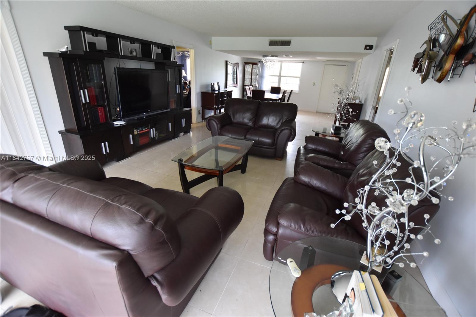 Move-in ready 3/2 split floorplan overlooking the golf course. Enjoy a stunning screened-in balcony with breathtaking views any time of day. Both bathrooms have been updated, and the home features stainless steel appliances, a Nest thermostat, walk-in closets, and a stackable washer and dryer. Community amenities include two pools, a sauna, sand volleyball court, pickleball, basketball, tennis, and a gym. Conveniently located just ten minutes from the beach, with Topgolf, Publix, and Home Depot only a few miles away. Maintenance includes water, internet, and cable.