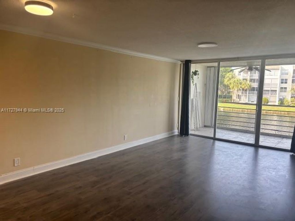 Photo of 9235 Lagoon Place #214, Davie, FL 33324 (MLS # A11727944)