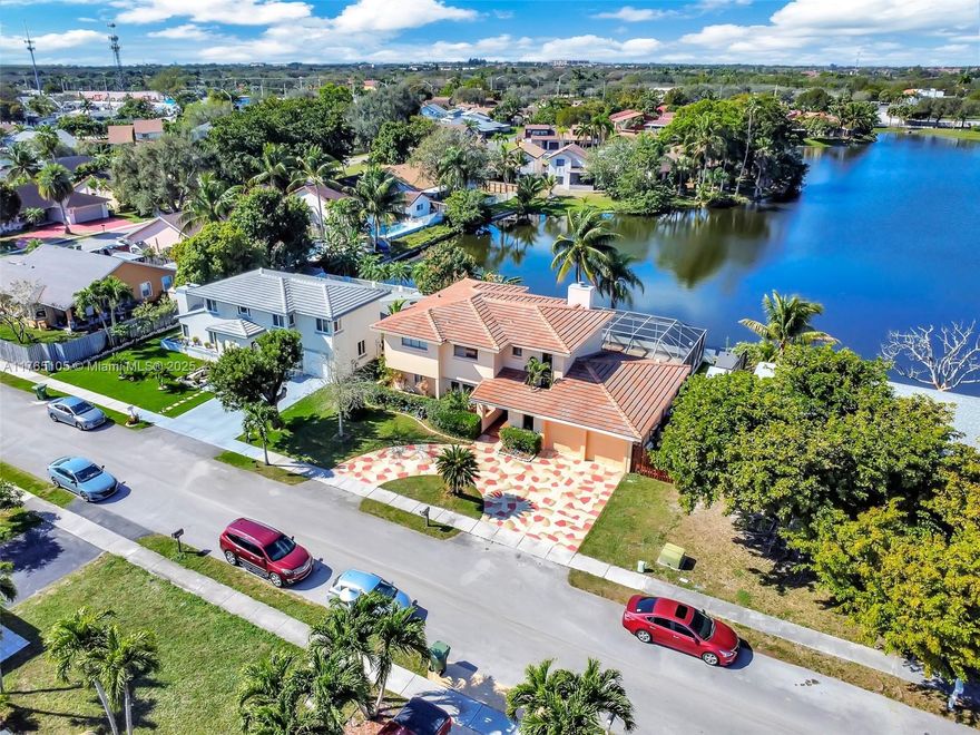 Experience luxurious lakefront living in this renovated 4-bedroom, 3-bath, one-story home. Featuring new bathrooms, a 2022 roof. Lake views, a newly screened private pool. The updated kitchen with marble countertops. nice backsplash High ceiling a stylish two-car garage enhance its appeal.  Situated in a great neighborhood with parks, and easy access to highways, airports, and shopping. Don't miss this rare opportunity with very low HOA.