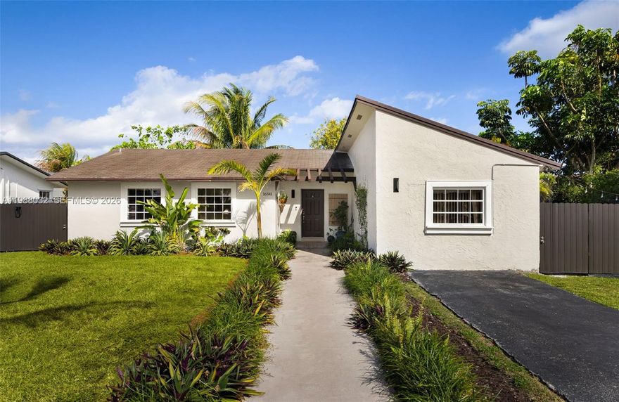 Updated 4-bedroom, 2-bath home in sought-after Palmetto Estates, offering bright, inviting living spaces and stylish upgrades throughout. The home features a modern white kitchen with granite countertops, stainless steel appliances, and custom wall paneling that adds warmth and character to the main living area.

A standout feature is the glass-enclosed Florida room — the perfect flex space for entertaining, relaxing, or working from home.

The garage has been thoughtfully converted with permits into a 4th bedroom, offering added living space, with the flexibility to convert back if desired. Set on an oversized, fully fenced lot, the backyard offers plenty of room to add a pool, store a boat or RV, and includes two storage sheds for added convenience.

Ideally located near Killian Greens Golf Club, top-rated schools, parks, and everyday conveniences, this move-in ready home blends comfort, style, and future potential.