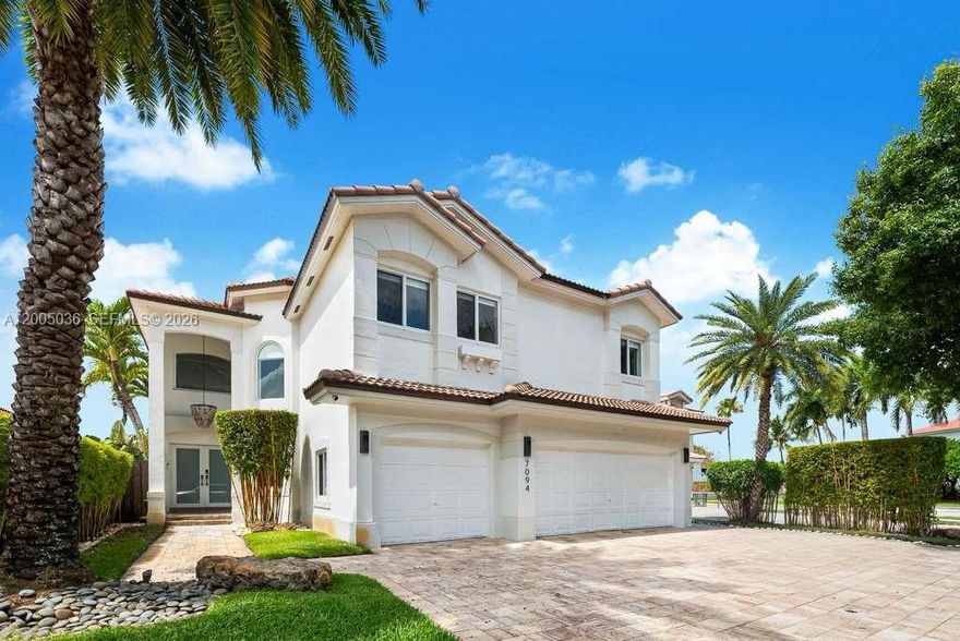 Light-filled 2-story home w/relaxing views to the pristine pool & lake in highly desired Doral Isles. 5 bedrooms, 3 bathrooms, 3 cars garage. 1 bedroom and 1 full bathroom downstairs. 1 home office. The master suite features a large walk-in closet with built-ins and en suite bathroom with dual vanities and spa tub. Great for entertaining friends and family, the outdoor patio contains a heated pool, covered seating and flawless summer kitchen beneath a pergola. New roof in 2023. Doral Isles features lush green spaces, baseball field, basketball court, soccer field, tennis courts, beach volleyball court, gym and two pools at the premier club house.