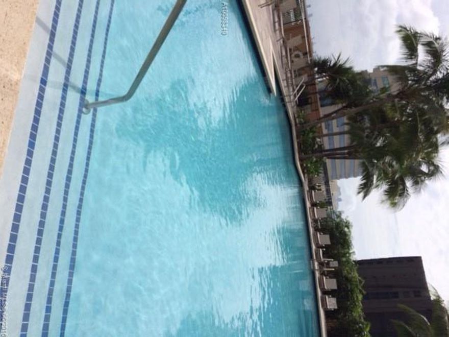 Large 1 Bedroom and 1 den / 1 bathroom unit featuring elegant wood floors throughout, stainless steel appliances, granite counter tops w/ spectacular views of Miami skyline & the pool deck. Ideal location: 2 blocks from historic Miracle Mile w/best dining/shopping options, across from Miracle Market Place & just 7 min from Brickell. Luxury Condo w/24-hr Concierge, heated-pool, gym, sauna, club house & business center. 1 assigned covered parking included.