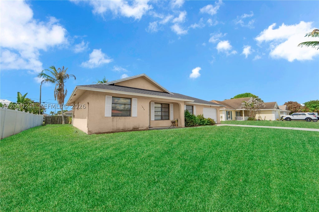 Photo of 1074 SW Alcantarra BLVD, Port St Lucie, FL 34953 (MLS # A12039241)