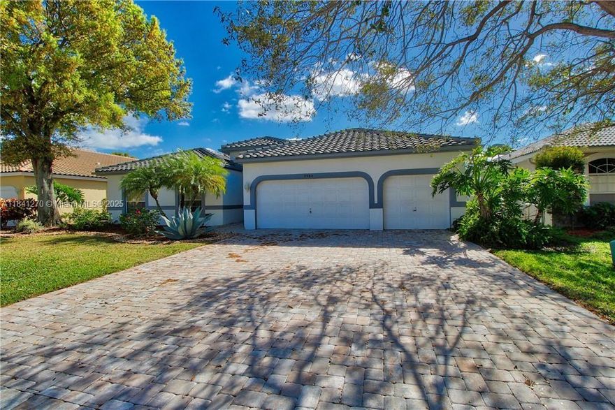 Welcome to this beautiful and bright four-bedroom, two-bathroom home located in the desirable Parkwood community in Parkland. This spacious residence features a three-car garage and a large paver driveway. Inside, you’ll find an updated eat-in kitchen with a breakfast bar that overlooks the open-concept family room an ideal setup for entertaining guests. The dining room, living room, and family room all offer serene views of the lake and open out to a screened-in patio with a sparkling pool, perfect for enjoying Florida’s outdoor lifestyle. The large master bedroom includes sliding doors that lead directly to the patio, allowing you to enjoy your morning coffee with a lake view. This home is perfectly situated just minutes from schools, fine dining, shopping, parks, and major highways.