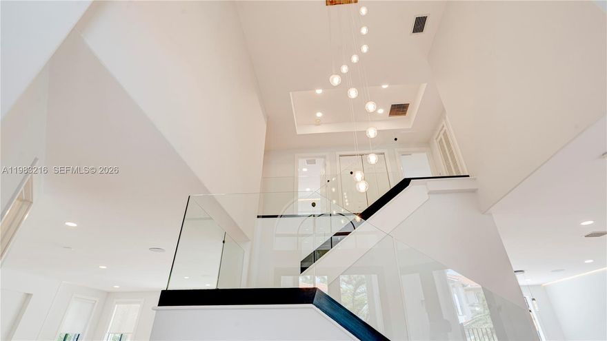 Completely renovated luxury home with high-end finishes, designer details, premium smart-home features throughout. This exceptional residence offers a modern, light-filled design w/everything completely new, combining contemporary elegance with comfort, functionality and resort-style outdoor living. Main Features are: Fully newly renovated with luxury finishes & equipment throughout; Bright, modern interior with light tones & warm wood accents; Waterproof luxury vinyl flooring; Contemporary glass staircase; In-ceiling ambient LED light strips in every room; In-ceiling speaker installation; Kasa smart dimmer switches throughout the home, controllable via Alexa; Separate guest house w/ private bathroom; Beautiful pool area w/ lush tropical landscaping; Tikki Hut tropical patio lounge; Designer kitchen w/ premium finishes & thoughtful custom details: Thick marble countertops; Light-color palette with elegant wood elements; Large kitchen island w/ integrated LED lighting; Induction cooktop with hood; Soft-close cabinetry throughout w/ BLUM hinges; High-end interior cabinet drawer organization for cutlery, spices & more; LED-lit shelving; Wine cooler; Luxury bar sink with premium accessories, including waterfall faucet, cutting board; Spacious pantry w/ ample storage & Motion-sensor shelf lighting, all bathrooms have Floating vanities- Primary has double; LED vanity mirrors; Marble showers w/ floating glass enclosures; Smart toilets w/heated seats & automatic flush. A MUST SEE!