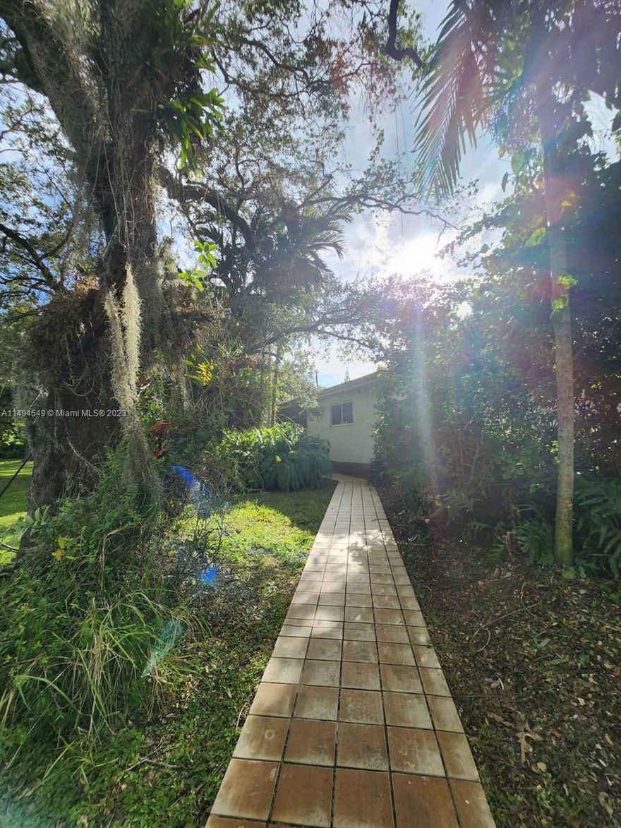 Beautiful 3/3 plus huge Family room and dark room with attached 2 car garage and concrete driveway with RV pad. It’s all nestled on 1 acre that runs between 63rd Crt  and 63rd Ave in the desirable South Miami area right off of Miller Drive. It’s an older home built in 1958 with updated hurricane impact windows and garage doors, the bathrooms have been updated.