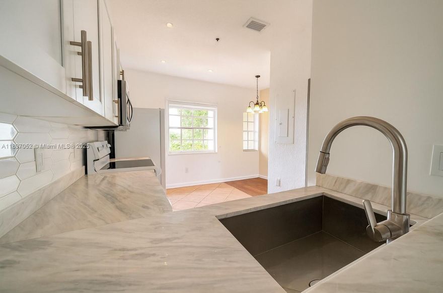 Experience the best of Doral living in this stunning 2-bedroom, 2.5-bath townhouse-style condo perfectly designed for young families and professionals. The first floor features an elegant open-concept layout with a bright living and dining area, modern kitchen, and a stylish half bathroom for guests. Upstairs, both bedrooms include private full bathrooms for maximum comfort. Step onto your balcony overlooking lush greenery, perfect for relaxing or entertaining. Enjoy resort-style amenities including a pool, gym, and tennis courts, all within a secure gated community. Conveniently located near top-rated schools, shops, restaurants, and with easy access to major highways, Downtown and Midtown Doral are just minutes away!