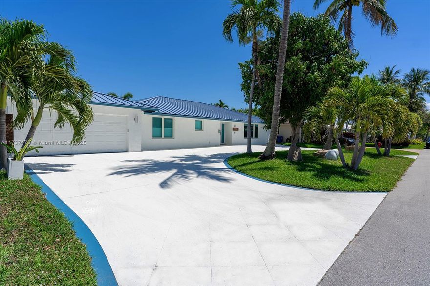 Stunning waterfront 4 bedroom home with 55 feet on the Intracoastal in East Fort Lauderdale’s coveted Lake Estates. This light-filled, updated residence offers an open-concept layout with tile floors and hurricane-impact windows throughout. The sleek, modern kitchen features quartz countertops, stainless steel appliances, double convection oven, wine refrigerator, and a reverse osmosis system—perfectly positioned to overlook the saltwater pool and waterway. Boaters will love the 14,000 lb boat lift, dock, new pilings, and seawall (2018). Additional upgrades include a metal roof, new AC (2023), 2-car garage with ChargePoint Level 2 EV charger, circular driveway, and pavered pool deck. A true turnkey gem made for entertaining and enjoying the South Florida lifestyle.