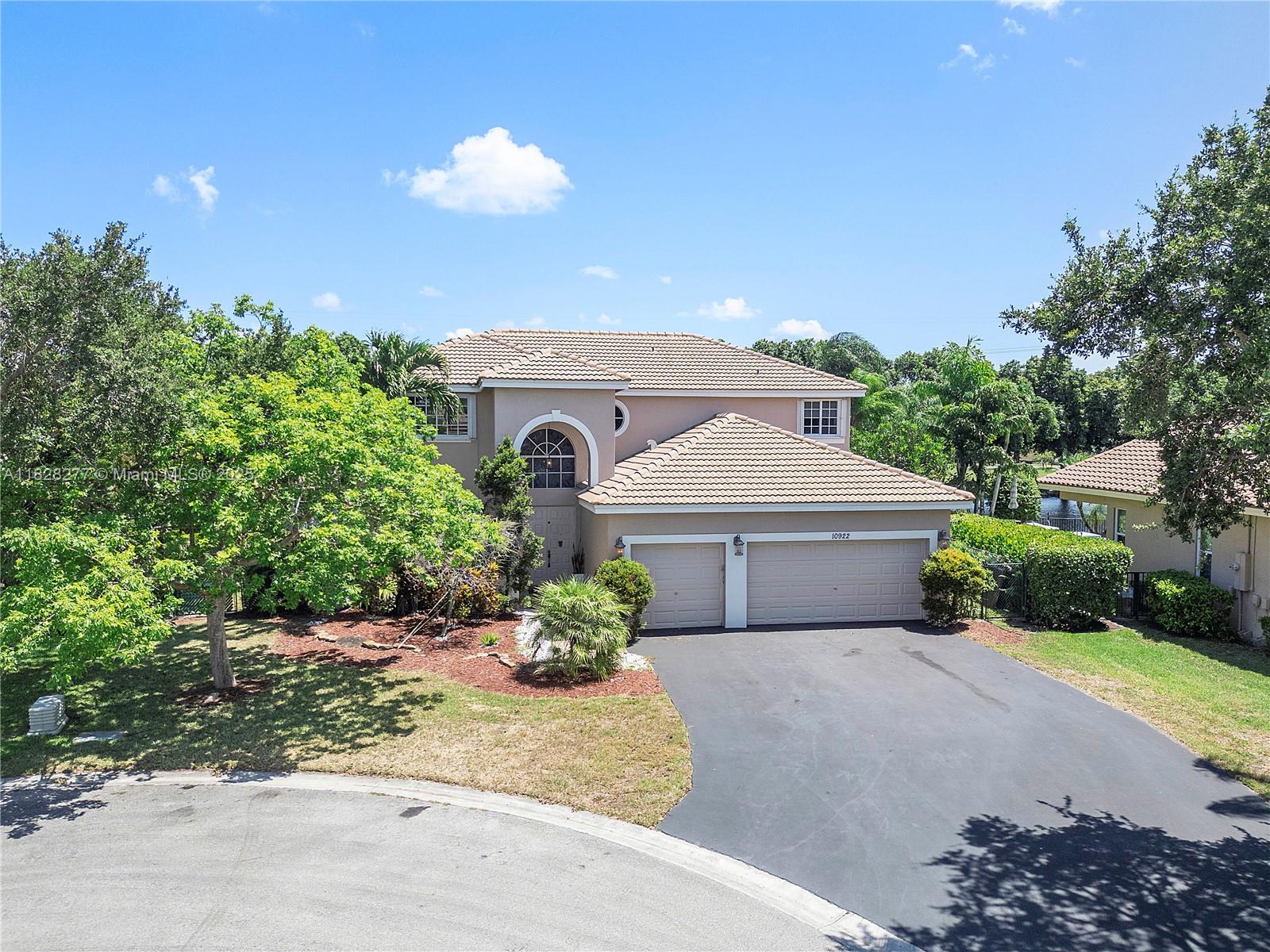 Beautifully Updated 5-Bed 3-Bath Waterfront Pool Home Located In Prestigious Kensington Glen In Coral Springs! The Home Features A Gourmet Kitchen (2024), W/Quartz Countertops, White & Gray Custom Cabinetry, And Café White Matte High-end Appliances With Bronze Finishes. New Roof (2023), Two New ACs (2024), New Water Heater (2023), New W/D (2025) & A New Pool Pump (2024). New Porcelain Tile (2024) And Wood Floors (2025). All Bathrooms Updated (2024), With A Primary Bath Offering Dual Vanities And A Separate Soaking Tub. Three Of The Four Upstairs Bedrooms Open To An Oversized Balcony With Stairs Down To Pool And Patio. The Primary Suite Provides Two Huge Walk-In Closets. Enjoy Tranquil Water Views, A Private Pool. Located Close To Highways, Shopping and Top Rated Schools —Don’t Miss It!
