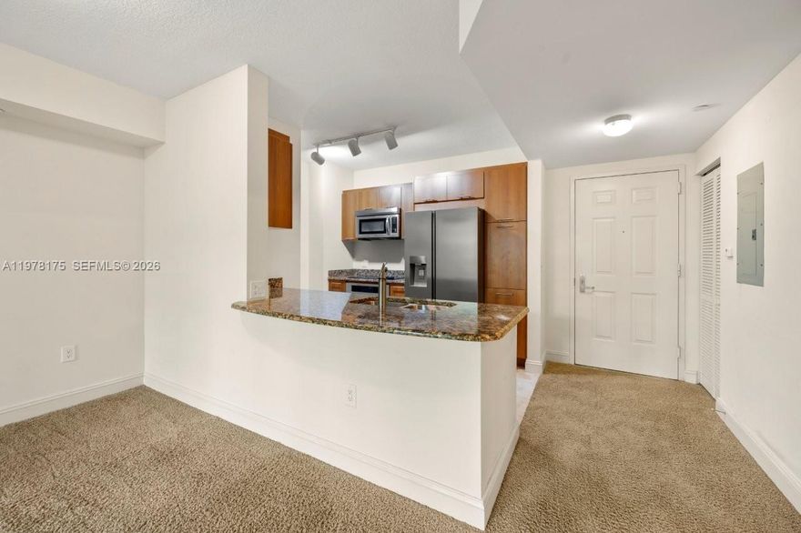 Welcome to this magnificent and impeccable one-bedroom condo overlooking the pool with access to the balcony from the bedroom and the living room. From the moment you step inside, you'll be captivated by the open and bright atmosphere. The kitchen is a true highlight, featuring Brand New Refrigerator – Brand New Washer-Dryer, Brand New Dishwasher. Convenience is key, with internet access, cable TV, and running water included in the rental package. You'll appreciate the attention to detail throughout this condo, including the impact glass windows that enhance security and provide a peaceful living environment. The property is in move-in condition, ensuring a hassle-free transition for the lucky occupants. In addition to its stunning interior, this condo offers a range of amenities that will enhance your lifestyle. The elegantly appointed lobby sets the tone for luxury living, while the resort-style tropical pool and Jacuzzi provide a tranquil oasis for relaxation. Stay active with the fitness center and dry sauna and enjoy the peace of mind provided by the 24-hour manned security at the front desk, and a high-tech security system. You'll find the Smart Key FOB entry into the building to be both secure and convenient, making coming and going a breeze. Overall, this rental property offers a luxurious and comfortable living experience, with its impeccable features, abundance of amenities, and attention to detail.