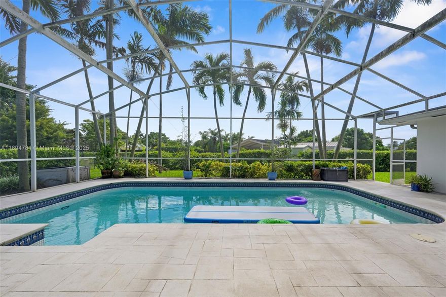 This elegantly remodeled 5-bed, 3-bath pool home offers a seamless open layout filled with natural light, impact windows, and refined finishes. The designer kitchen features quartz counters, stainless steel appliances, and a walk-in pantry. Spacious bedrooms include a private guest suite and a luxurious primary retreat with French doors, spa-style bath, and walk-in closet. Enjoy Florida living with a screened patio, resort-style pool, outdoor dining area, and lush landscaping on an 18,018 SF lot. Metal roof, circular driveway, 2-car garage, and extra storage. Move-in ready and NO HOA! Located in one of Palmetto Bay’s most desirable neighborhoods near top schools, parks, and shopping. A timeless home offering elegance, comfort, and unmatched lifestyle!