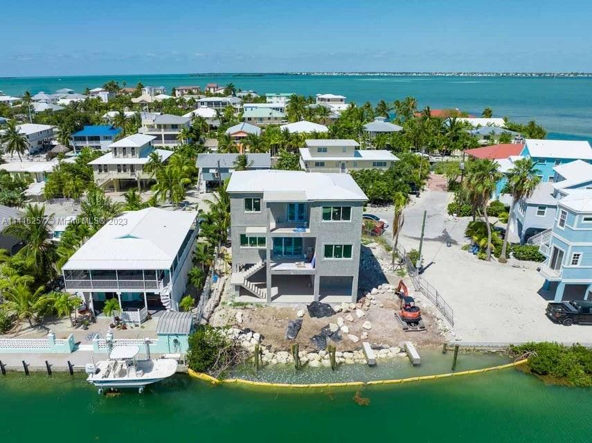 Spectacular Brand New Home in desirable Summerland Cove Isles situated on Deep Water Canal with Direct Ocean Access. Elevated CBS 4 Bedroom 3.5 Bath three story home with elevator, offering parking and storage on the ground floor and beautiful light open living space above. Two master suites, top of the line appliances, impact-resistant windows & doors and three terrace levels overlooking the water. Enjoy Ocean Views from the rooftop deck! Back yard retreat boasting a sparkling pool with sundeck and sitting ledge, 40' dock and new 20,000 pound boatlift and summer kitchen to maximize your poolside entertaining. Don't wait on this Summerland gem!
Agent Remarks: Entered for statistical purposes only.
Show: 24 Hour Notice; Call List Agent; LA Must Accompany