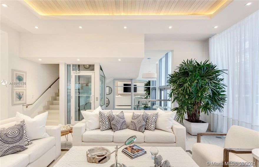 EXCLUSIVE TURN-KEY BEACHFRONT LUXURY TOWNHOUSE! Spanning over 4 stories, this meticulously appointed residence has a modern kitchen with top of the line appliances, private glass elevator, 4 spacious bedrooms with ensuite bathrooms & terraces, custom recessed lighting, Italian porcelain flooring, impact glass door & windows. The private 2 level outdoor patio includes a private plunge pool and BBQ kitchen area. 2 car garage + 1 outdoor parking space included with unit. Enjoy living steps from private beach access & service.