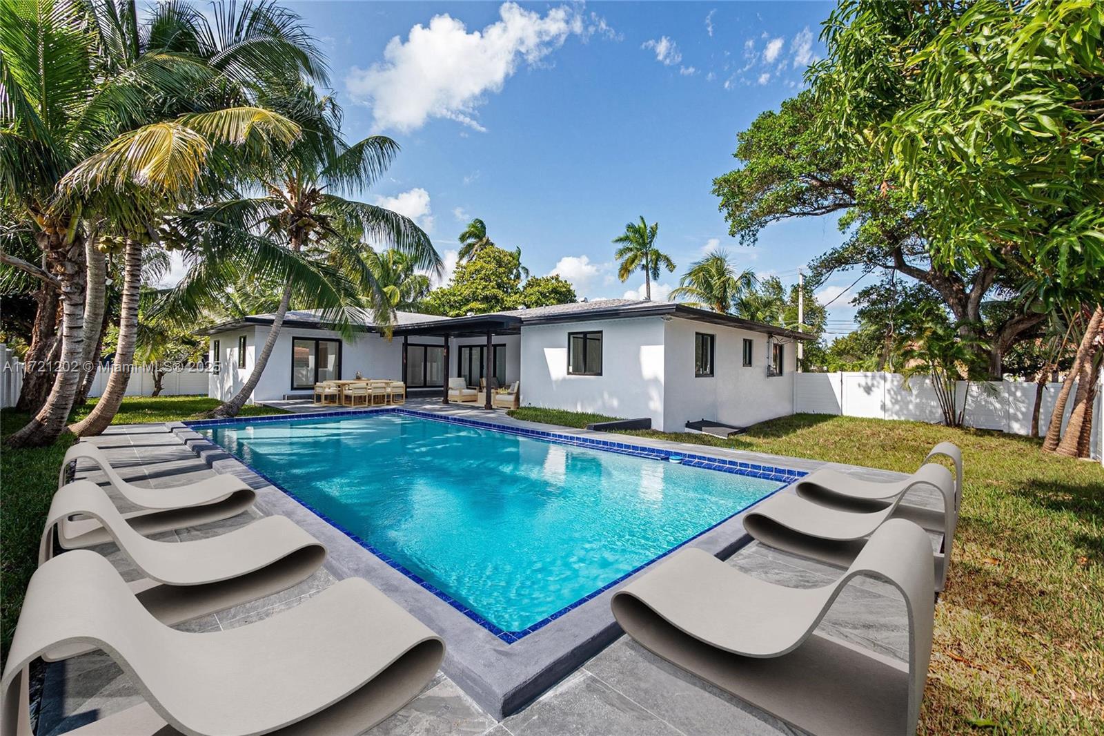 Bring your boat, RV, and exotic cars to this expansive triple lot, approved for building an additional guest house. Fully remodeled, this home combines luxury and comfort with a gourmet kitchen, spacious bedrooms, and modern bathrooms. Enjoy seamless indoor-outdoor living with a large living room, expansive patio, and sparkling pool, perfect for entertaining. The 2-car garage features an attic, ideal for an office or guest suite. New energy-efficient impact doors, windows, and appliances add style and convenience. Located near Pompano Pier and Downtown Pompano in a no-flood zone, this home offers prime convenience and peace of mind. Financing options include VA, FHA, conventional, and seller financing. Contact Sorty Mejia for a private tour today!