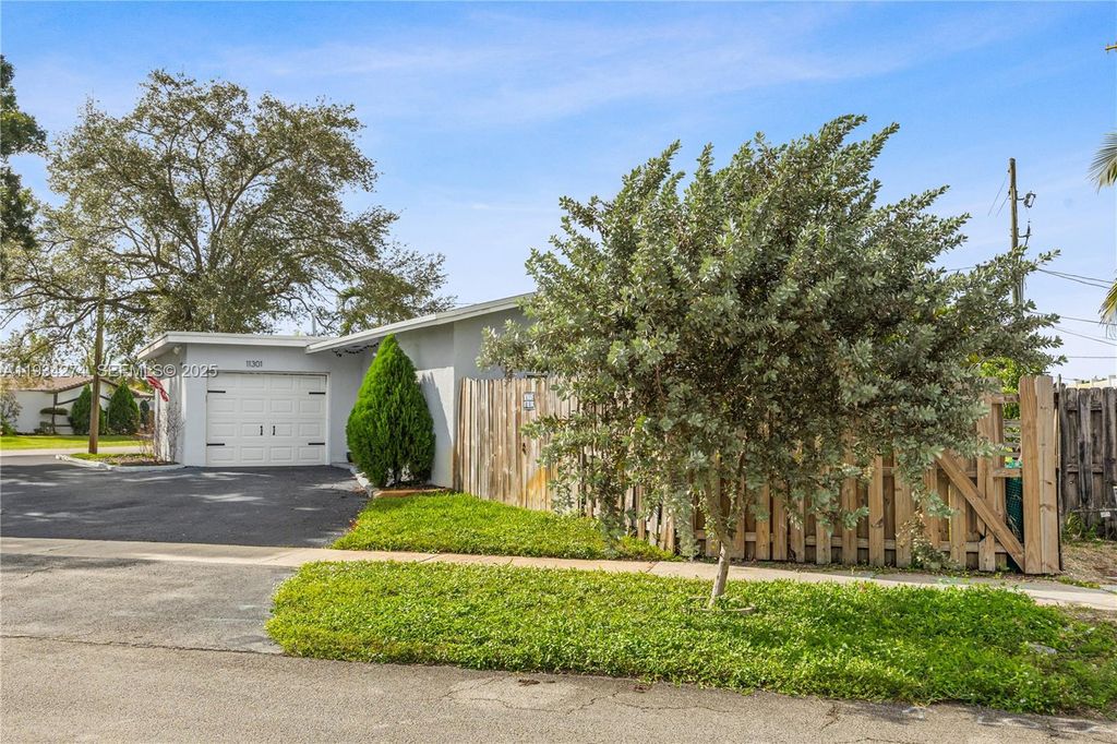 Photo of 11301 NW 32nd Pl, Sunrise, FL 33323 (MLS # A11934274)