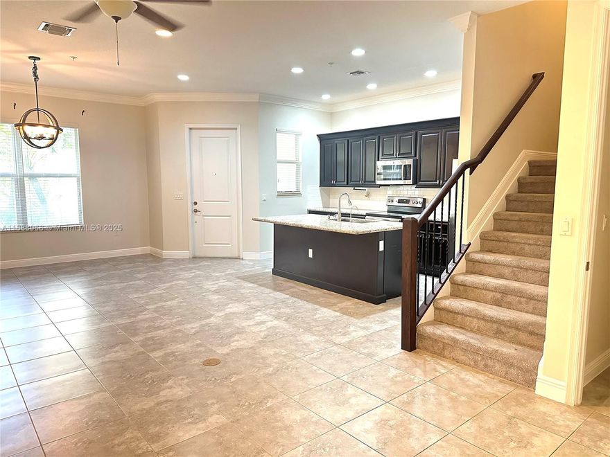Lovely and Stunning Townhome 3 bed-2.5 bath located in prestigious resort community of Centra Falls. Two stories, Two (2) covered car garage, plus 2 parking in driveway. Built in 2017, Open concept, this well-maintained home features large living area, dark wood cabinetry, granite countertops, stainless steel appliances, all Impact Windows, washer and dryer in separate laundry room, vaulted ceilings, spacious Master Bedroom/Master bath with private balcony. Gated Community, Great Amenities, beautiful community park, heated pool - Jacuzzi & exercise room. Truly a dream to live and enjoy every day. A lot of entertaining in the neighborhood, coffee shops, restaurants, great schools, Super Markets, CB Smith Park, and major shopping malls. DON'T MISS THIS OPPORTUNITY !!