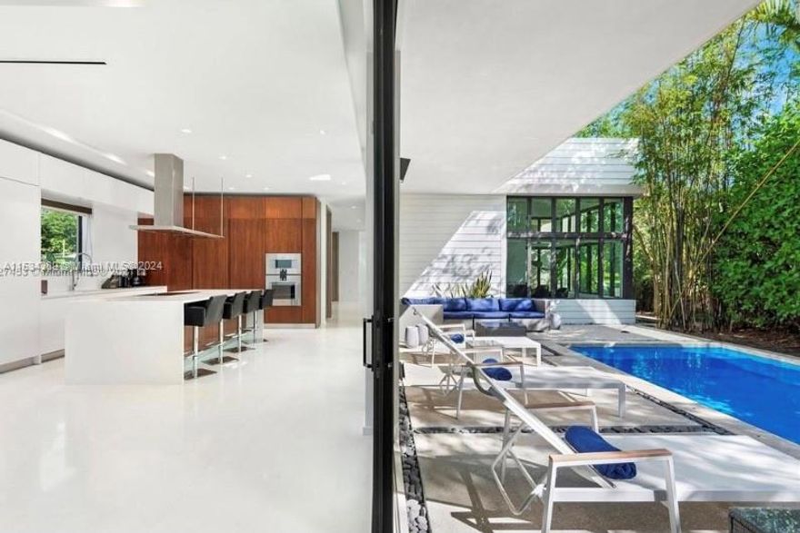 Casa Modello is the catalyst in the revitalization of South Miami Avenue. Surrounded by gracious historic homes and contemporary luxury residences just walking distance from the center of Miami’s vibrant Brickell neighborhood. This modern Villa offer a sleek two-story design with sweeping floor to ceiling windows, 5 master suites plus maids suite, smokeless cigar room and a temperature control wine cella; seamless indoor/outdoor living, and breathtaking rooftop terraces with views of the city skyline. Villa Leone is at 5,345 square feet plus rooftop terrace. An open great-room and Italian designed kitchen connect via sliding glass doors to the pool deck, summer kitchen, and outdoor dining area for effortless casual entertaining.