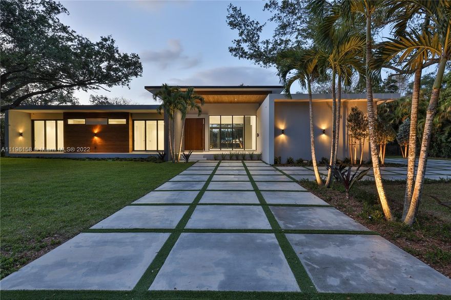 Welcome to this brand new modern construction in the heart of Pinecrest. This 5 bedroom, 5.5 bathroom fully gated one story masterpiece sits on a 38,766 sqft lot. The main entrance greets you with an impressive 11ft hurricane proof Mahogany pivot door. As you enter you will encounter high ceilings ranging from 10 to 14 ft throughout surrounded by all impact windows. Comes fully equipped with ITALKRAFT kitchen cabinets, quartz counters and Miele, Wolf and Liebherr appliances. All fully ensuite bedrooms are completed with MIACUCINA closets. No need to leave your home with a resort style backyard setting with a large pool and summer kitchen. A detached VIP 1 bed, 1 bath suite is perfect for guests. A 2 car garage with enough height for lifts is aesthetically located on the side of the home.