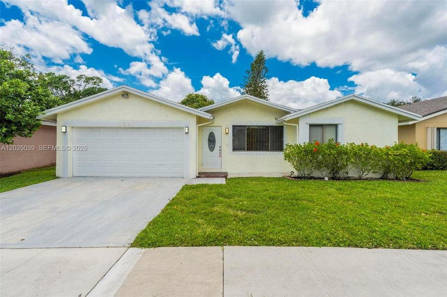 Incredible opportunity to own this bright and open 3-bedroom plus office, 2.5-bathroom pool home with stunning water views in the heart of Davie! Step inside to discover volume ceilings and freshly painted living areas flooded with natural light. The sprawling layout features a large kitchen complete with bar-top seating, a cozy breakfast area, and a spacious family room perfect for entertaining. Split floorplan. Primary bedroom has sliding glass doors to the pool and large walk in closet. Slide open the doors to your private backyard oasis, featuring a sparkling pool, peaceful water views, three mature mango trees, and a rare cashew tree. All of this with a low HOA! Don't miss this Davie gem.
