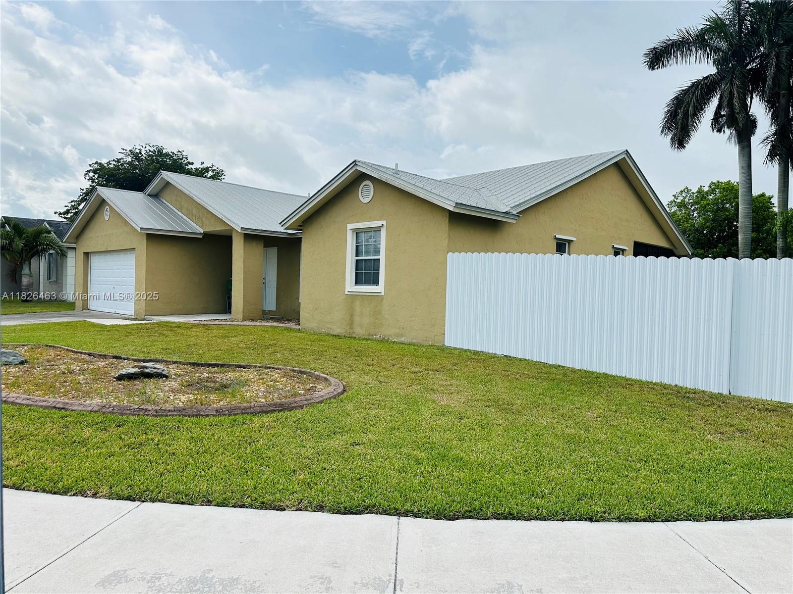 Charming turn-key 3/2 single family home situated on an extra large corner lot w/ new privacy fence, multiple rolling gates (12-14 feet), storage shed, 2 car garage w/ side entrance door & huge screened back porch w/ 2 sliding doors & 2 impact windows. Vaulted ceilings, metal roof, updates throughout, 2024 A/C, newer tankless water heater, tile/wood flooring, brand new light/bright kitchen & master bath w/ stone countertops & high end finishes/fixtures. New stainless appliances & lighting/fans. Master suite w/ 2 closets & bathroom renovation. Plenty of room to park cars/rec. vehicles/toys. Conveniently located close to the Turnpike, shopping, restaurants, schools, parks & places of worship. Don't miss this opportunity to purchase a well-priced home w/ all its improvements, it won't last.