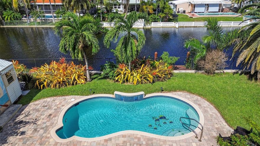 Calling all investors or move in, AS IS! This furnished, mid-century home is a fantastic turnkey asset for a short or long-term rental or a high-return fix-and-flip. The property is a vacationer's dream, waterfront, featuring a pool, private dock, and a large backyard perfect for outdoor living. Fully furnished with brand-new furniture, it's ready for immediate income generation. Recent upgrades, including a newer roof and A/C, minimize initial capital expenditures. There is no HOA, which maximizes cash flow. The property has ample space for a boat and is steps from North Lake, the Intracoastal, and Hollywood's top attractions—just 2 miles from the Hollywood Beach Boardwalk and 1 mile from Downtown Hollywood. This is a rare, high-demand asset. Secure, turn-key asset for your portfolio. ***Waterfront/access does not connect to the intercoastal.***