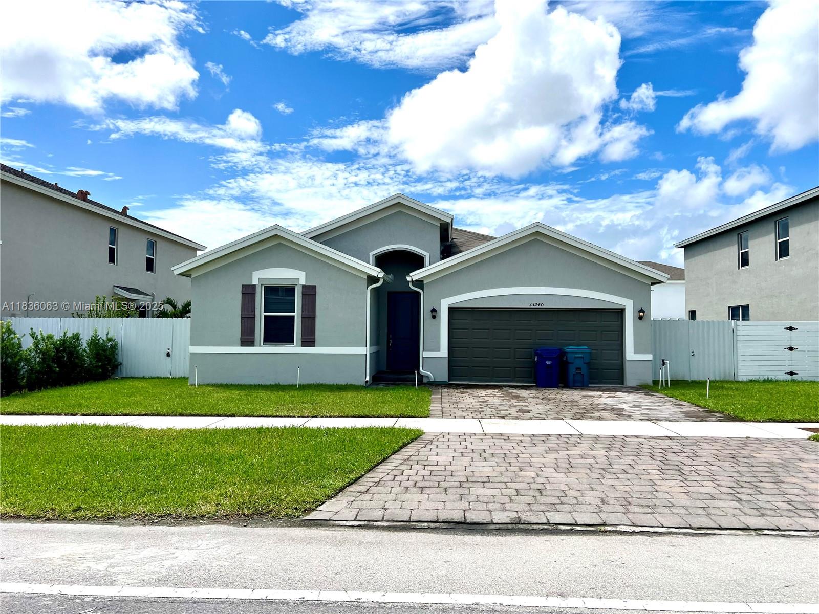 Welcome to this beautiful 3 bedroom 2 bath house for rent in Homestead. Property was built in 2020 making this home brand new with new appliances and AC. The home will greet you with high ceilings, open floor plan, perfect for entertaining. Primary bedroom features a tub, shower and huge walk in closet. As you exit outside you will find a newly done covered patio decking with pergola and artificial grass. Washer and dryer in the home. NO HOA. Rapid approval.