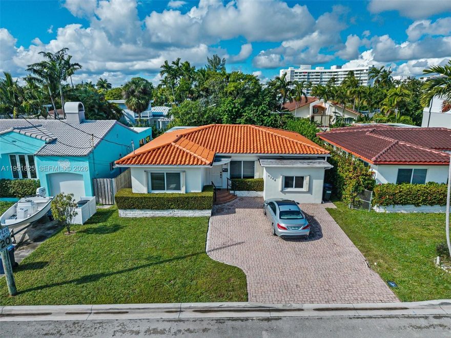 Nestled in the heart of the prestigious "Uptown Beachtown" of Surfside, 9248 Dickens Avenue offers a rare opportunity to own a quintessential coastal retreat just blocks from the Atlantic Ocean. This charming 3-bedroom, 2-bathroom residence features a spacious 1,688-square-foot layout on a lush 5,600-square-foot lot, providing the perfect canvas for a modern renovation or a serene move-in-ready lifestyle. The home has great bones, impact windows and concrete floors. Residents enjoy unparalleled walkability to the world-class Bal Harbour Shops, elite dining on Harding Avenue, and the top-rated Ruth K. Broad K-8 Center, all while gaining exclusive access to the beachfront Surfside Community Center. Whether you’re looking for a peaceful family home or a high-value investment in one of Miami’s most stable markets, this property perfectly captures the breezy, sophisticated essence of South Florida living.