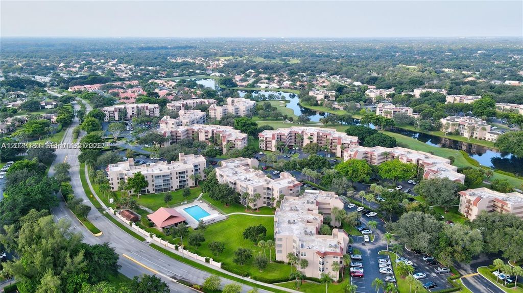 Photo of 1920 Sabal Palm Dr #104, Davie, FL 33324 (MLS # A12028180)
